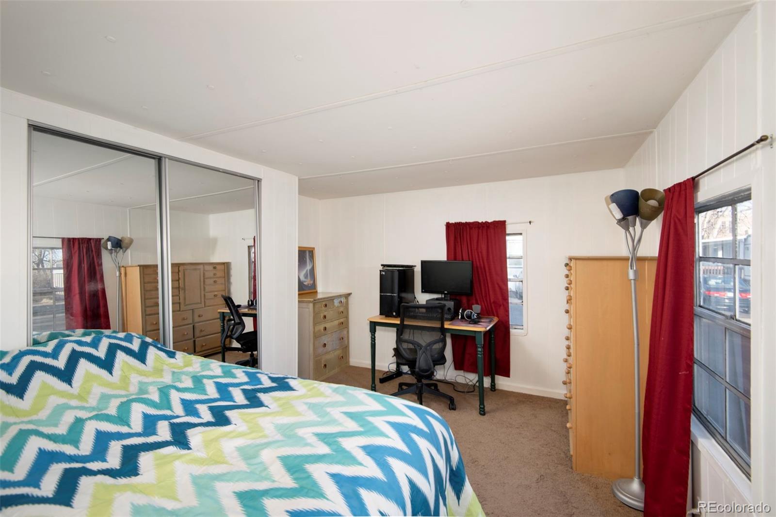 5000 Butte Boulder, CO 80301 - Photo 16 of 30 a bedroom with a bed a desk and chair