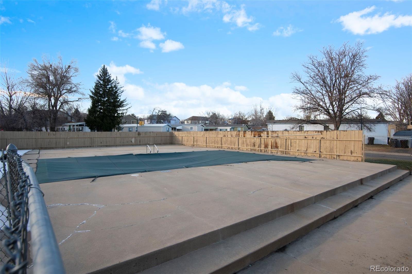 5000 Butte Boulder, CO 80301 - Photo 22 of 30 a view of a swimming pool with an outdoor space and seating area