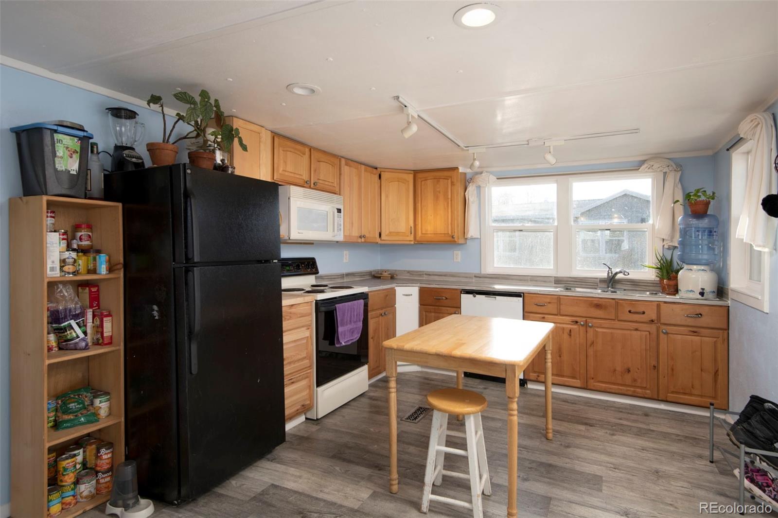 5000 Butte Boulder, CO 80301 - Photo 5 of 30 a kitchen with stainless steel appliances granite countertop a refrigerator and a stove top oven