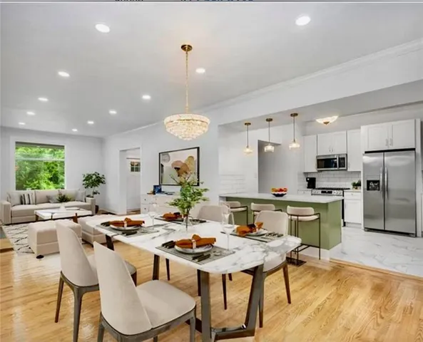 a kitchen with a table and chairs in it