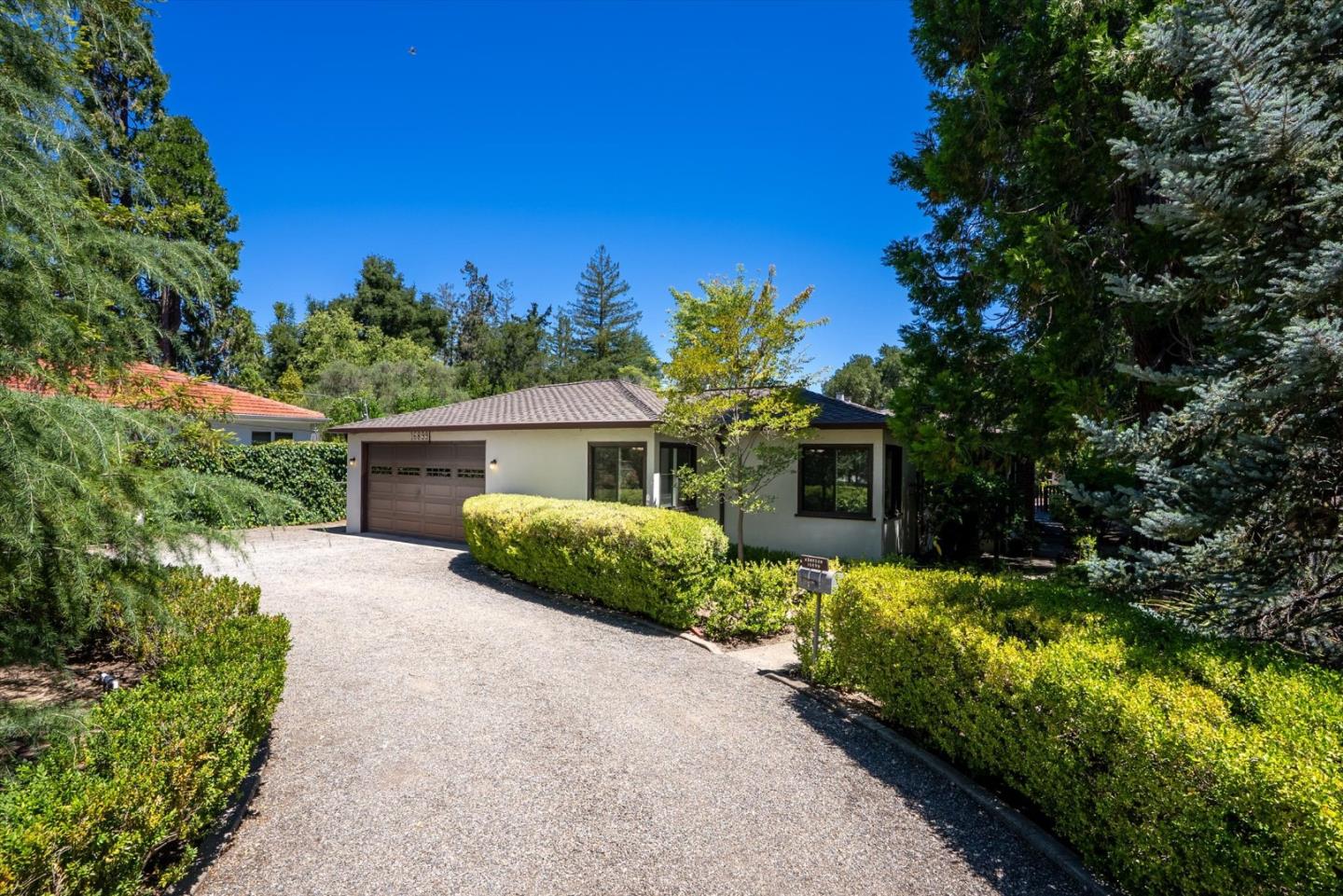 16899 Kennedy Road Los Gatos, CA 95032 - Photo 23 of 61 a front view of a house with a yard