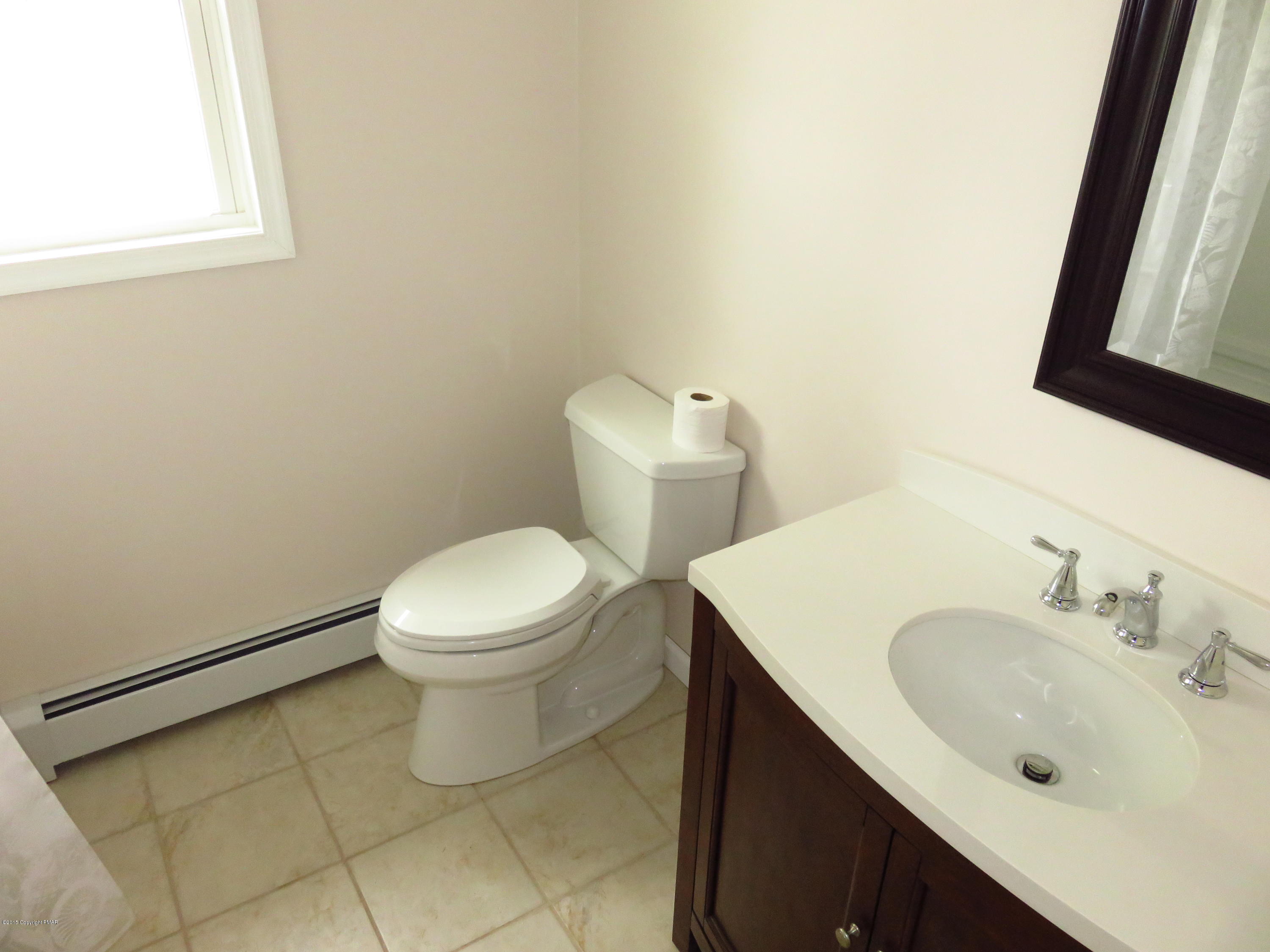 4066 Long Run Road Lehighton, PA 18235 - Photo 12 of 18 a bathroom with a sink a toilet and a mirror