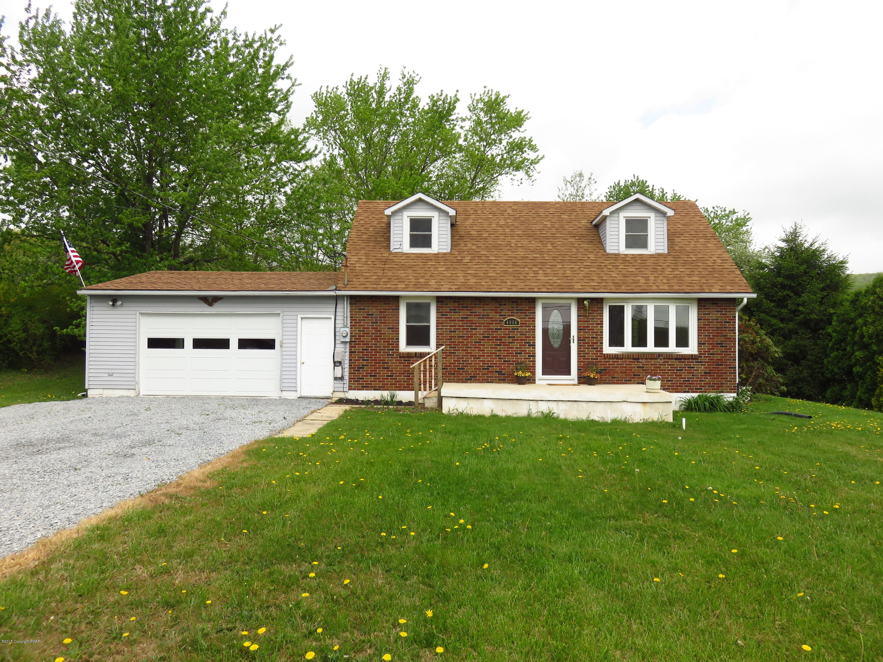4066 Long Run Road Lehighton, PA 18235 - Photo 16 of 18 a front view of a house with a garden and yard
