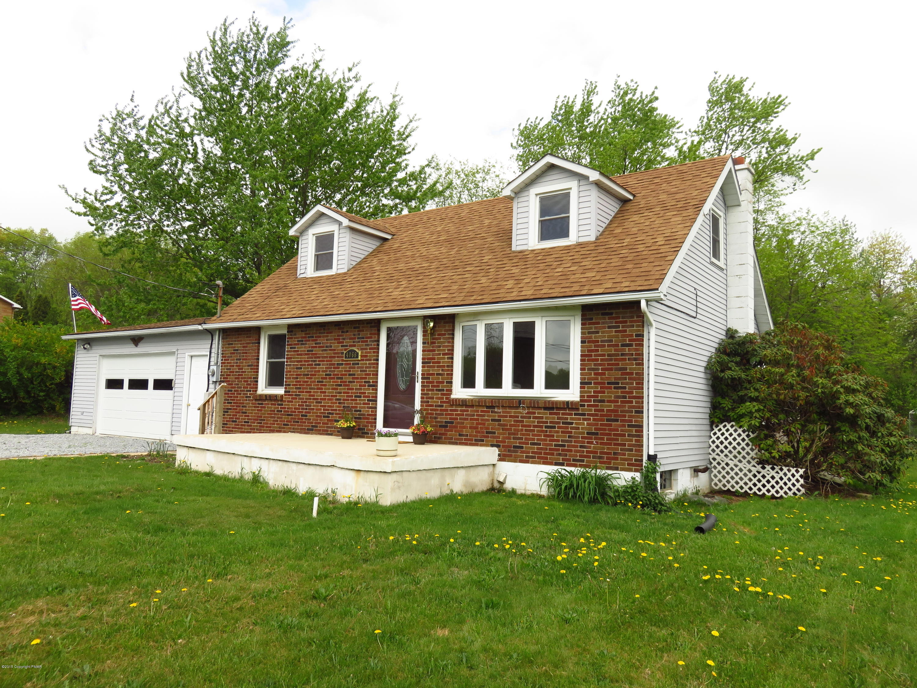 4066 Long Run Road Lehighton, PA 18235 - Photo 17 of 18 a front view of a house with a yard and garage