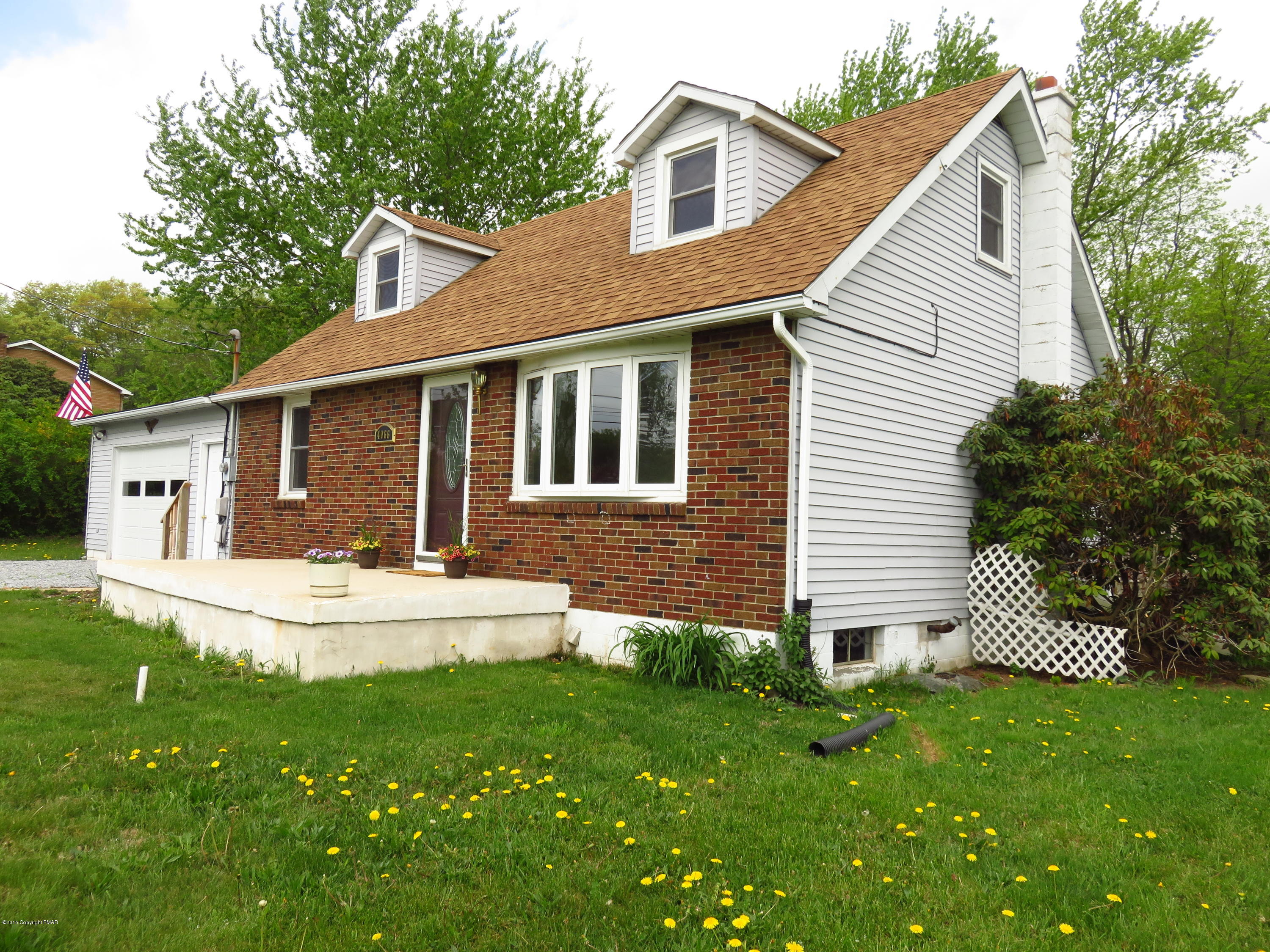 4066 Long Run Road Lehighton, PA 18235 - Photo 18 of 18 a view of a house with a yard and a garden