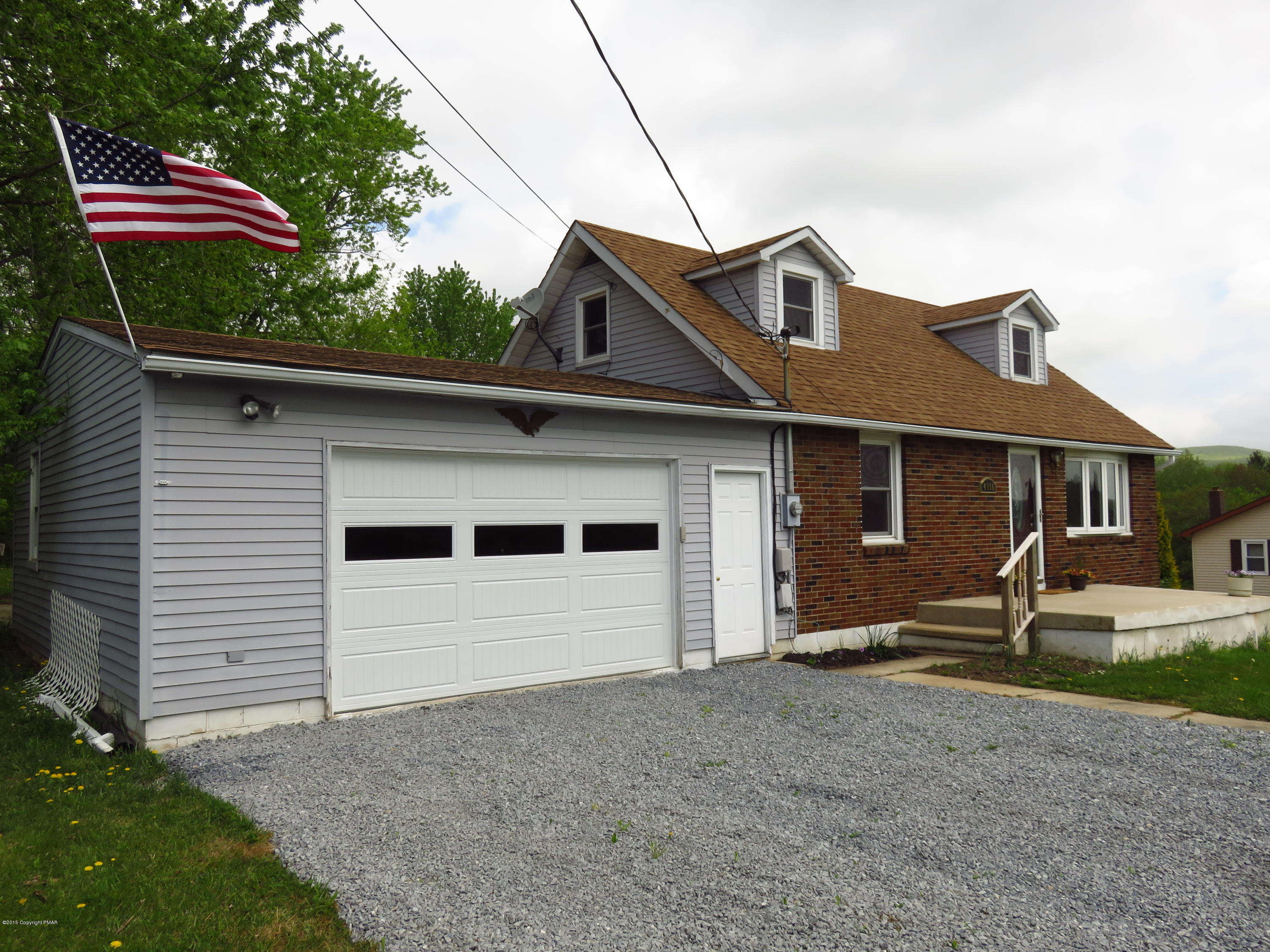 4066 Long Run Road Lehighton, PA 18235 - Photo 2 of 18 a front view of a house with a yard and garage
