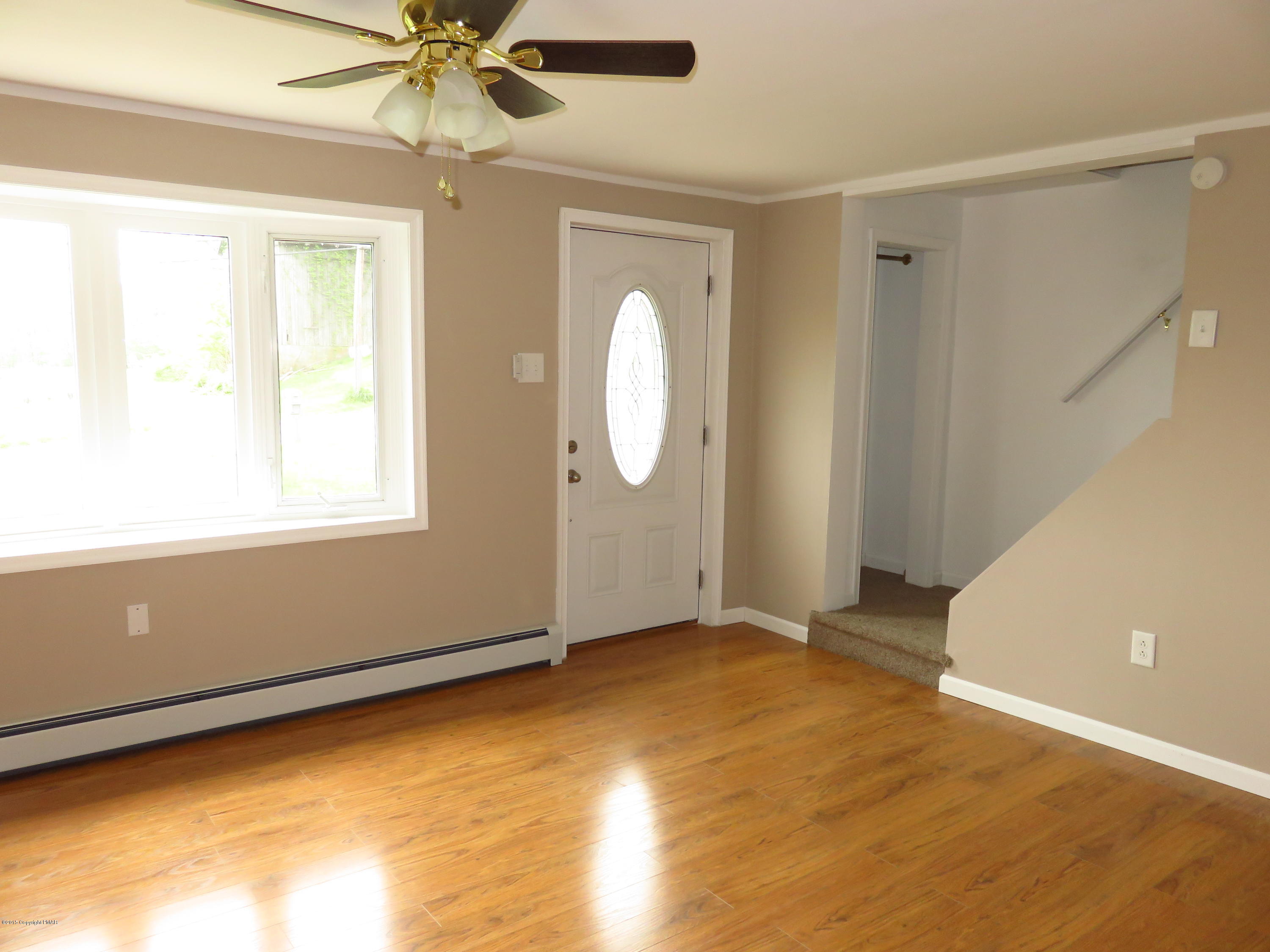 4066 Long Run Road Lehighton, PA 18235 - Photo 3 of 18 a view of a room with window a ceiling fan and wooden floor