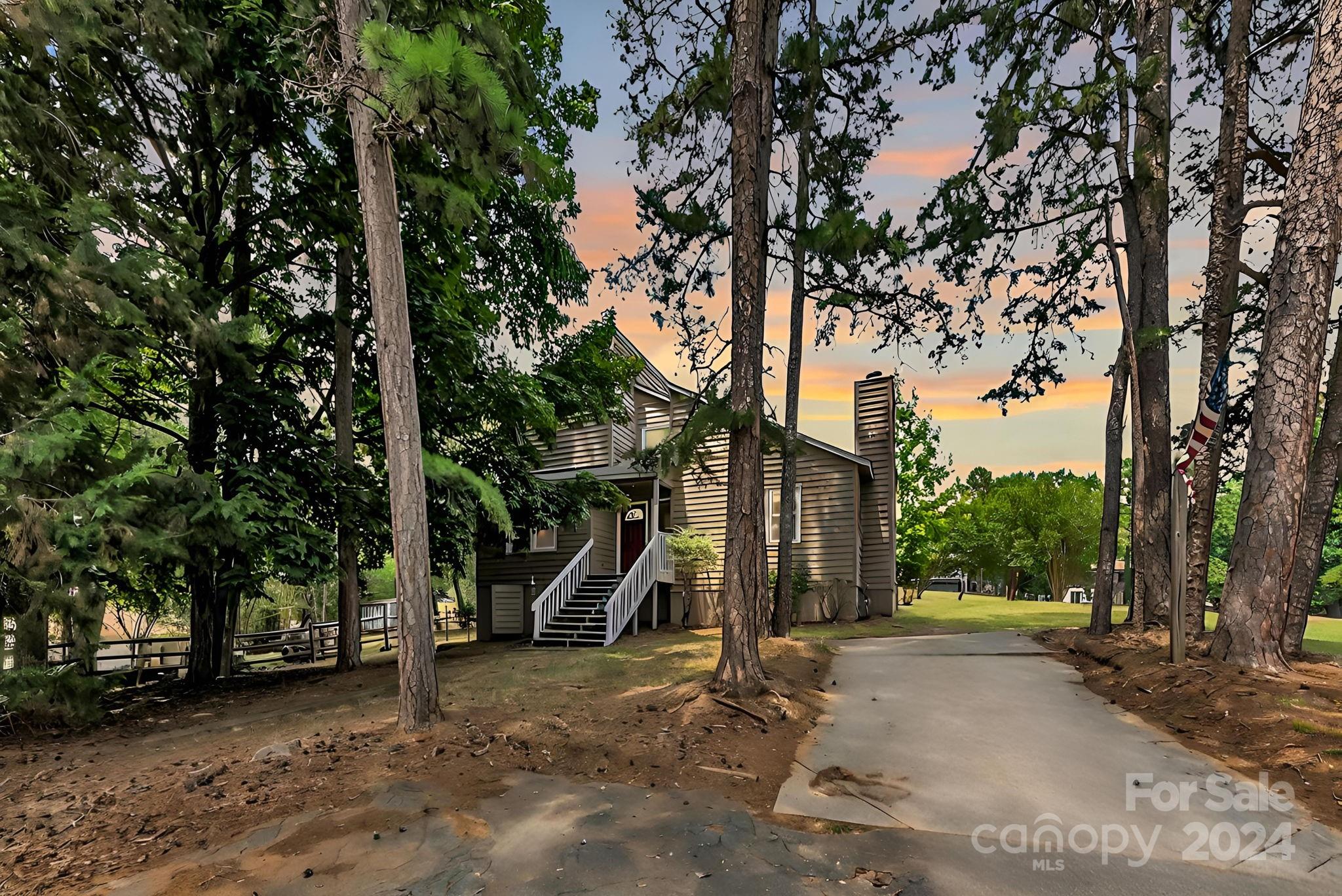 1018 Palmyra Drive Tega Cay, SC 29708 - Photo 1 of 36 a view of a park that has a large tree
