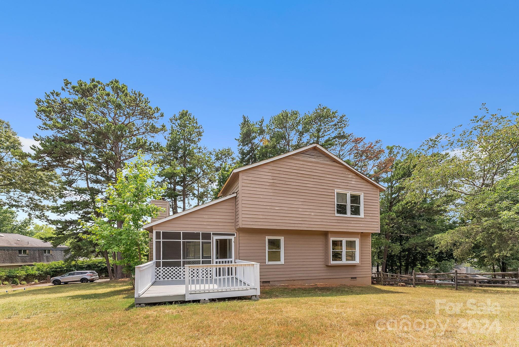 1018 Palmyra Drive Tega Cay, SC 29708 - Photo 12 of 36 a front view of a house with swimming pool