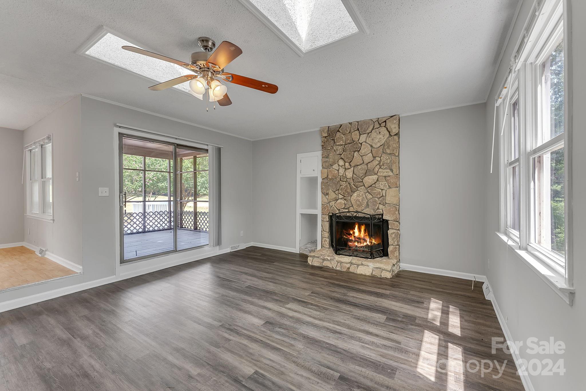 1018 Palmyra Drive Tega Cay, SC 29708 - Photo 17 of 36 wooden floor in an empty room with a window