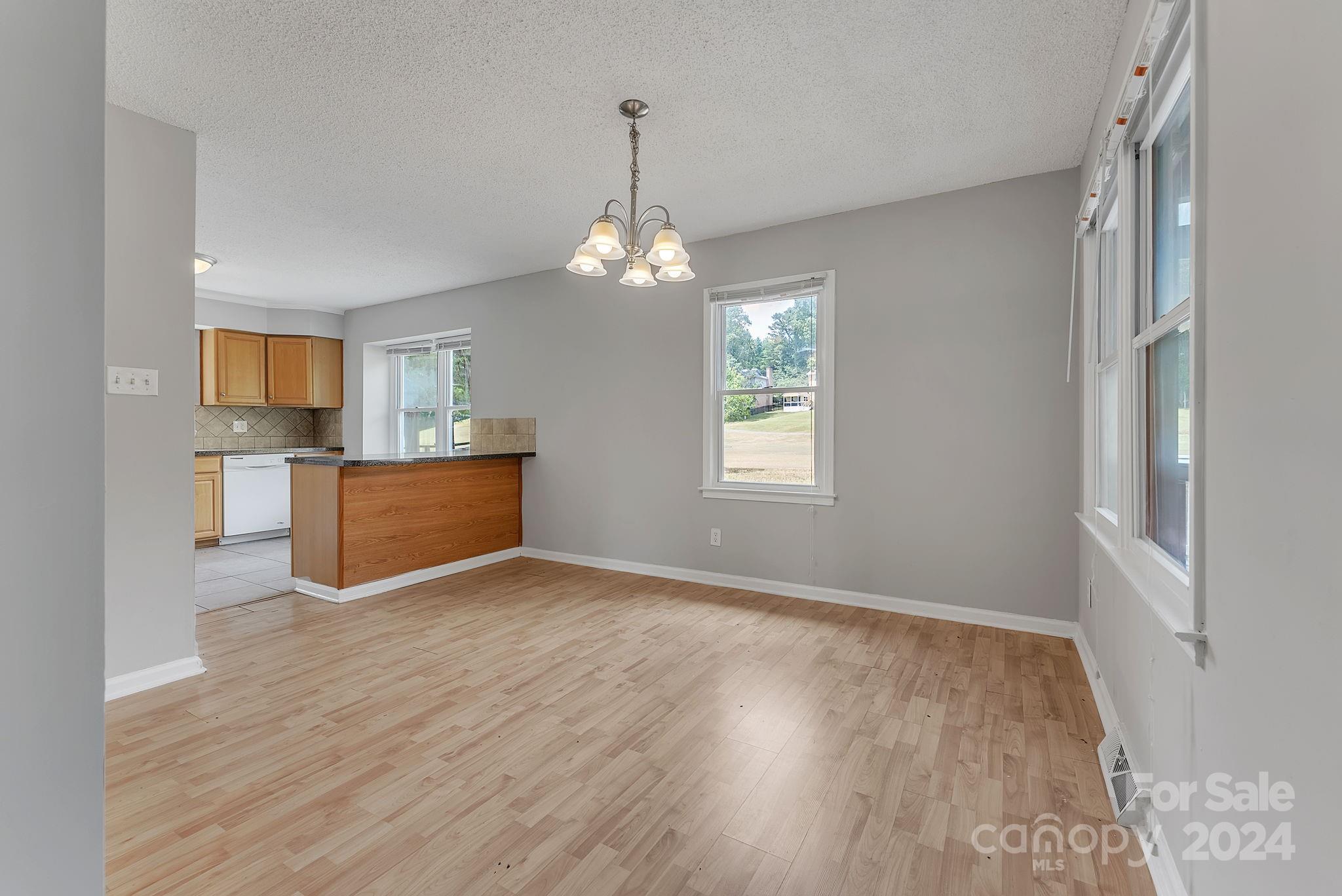1018 Palmyra Drive Tega Cay, SC 29708 - Photo 19 of 36 a view of a room with wooden floor and a window