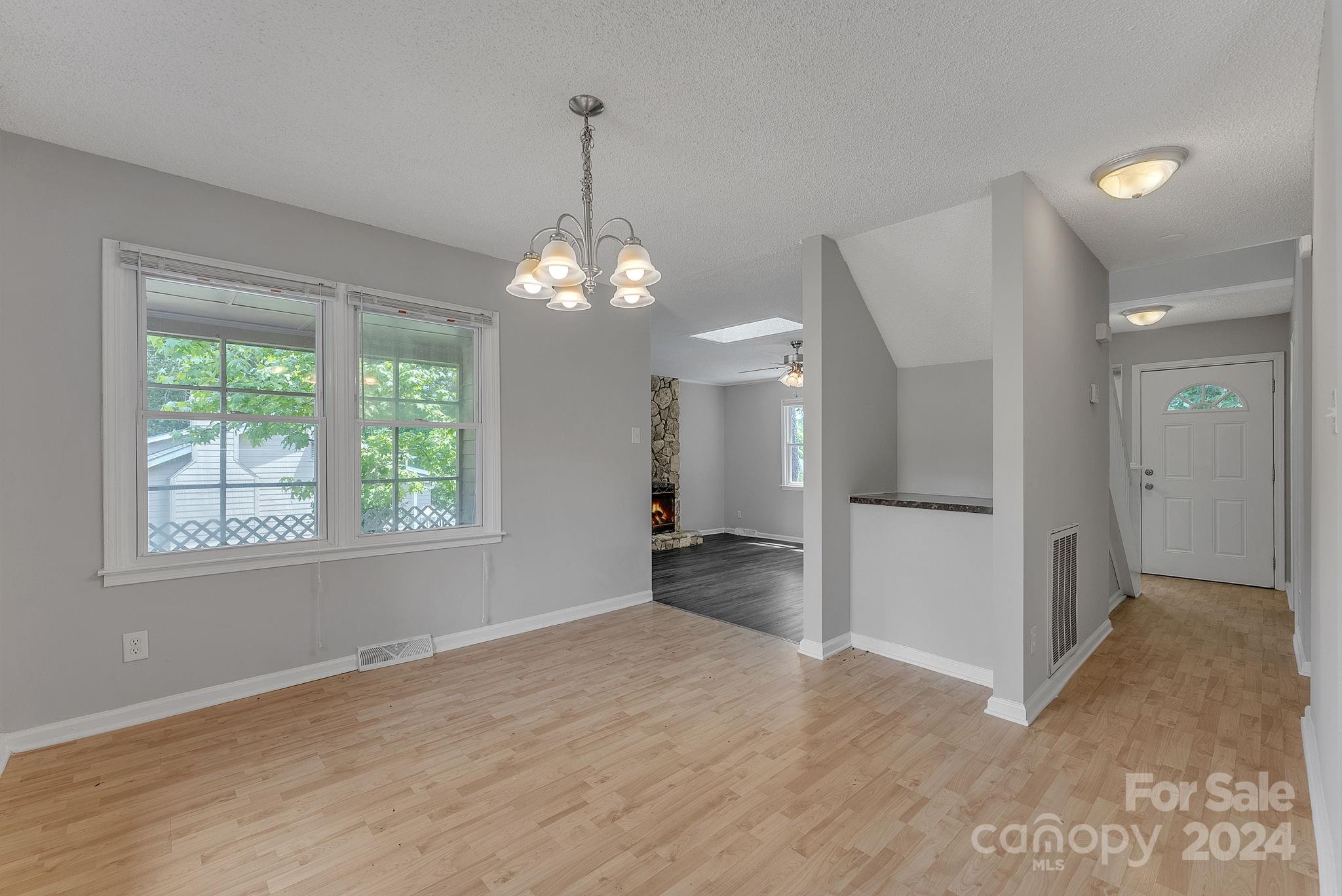 1018 Palmyra Drive Tega Cay, SC 29708 - Photo 23 of 36 a view of a livingroom with a chandelier
