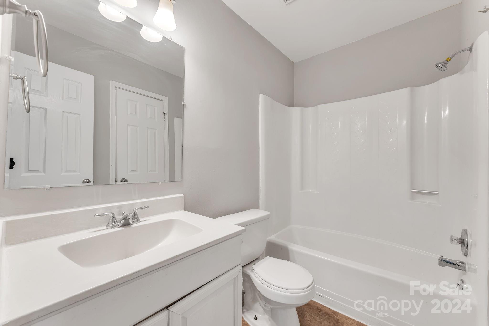 1018 Palmyra Drive Tega Cay, SC 29708 - Photo 25 of 36 a bathroom with a sink toilet vanity and bathtub
