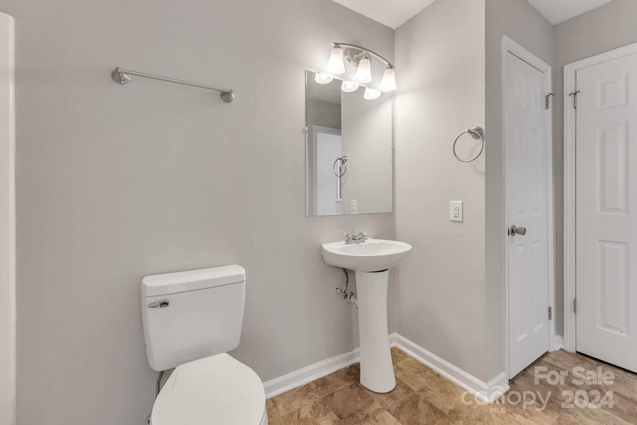 1018 Palmyra Drive Tega Cay, SC 29708 - Photo 33 of 36 a bathroom with a sink toilet and shower