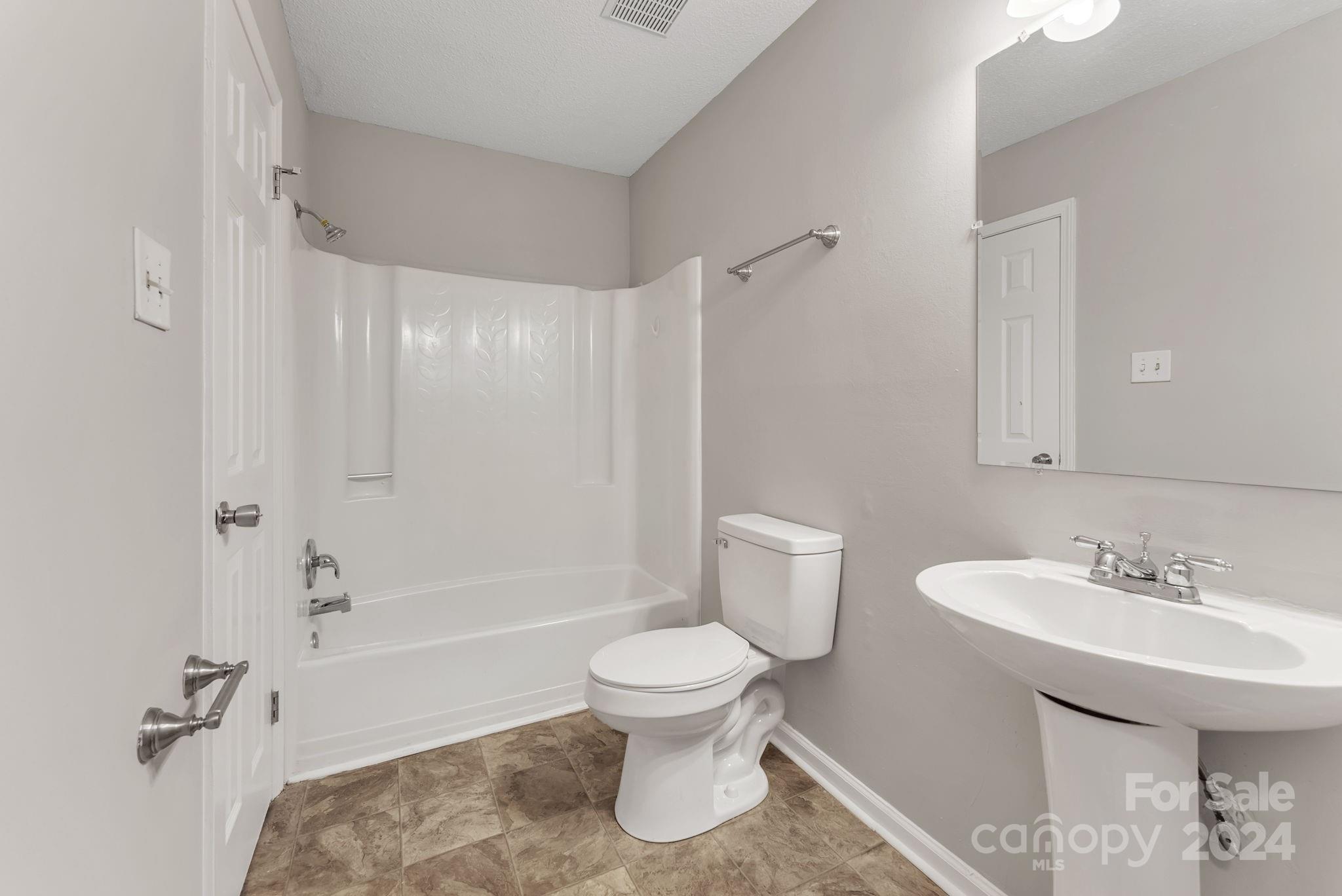 1018 Palmyra Drive Tega Cay, SC 29708 - Photo 34 of 36 a bathroom with a sink toilet and shower