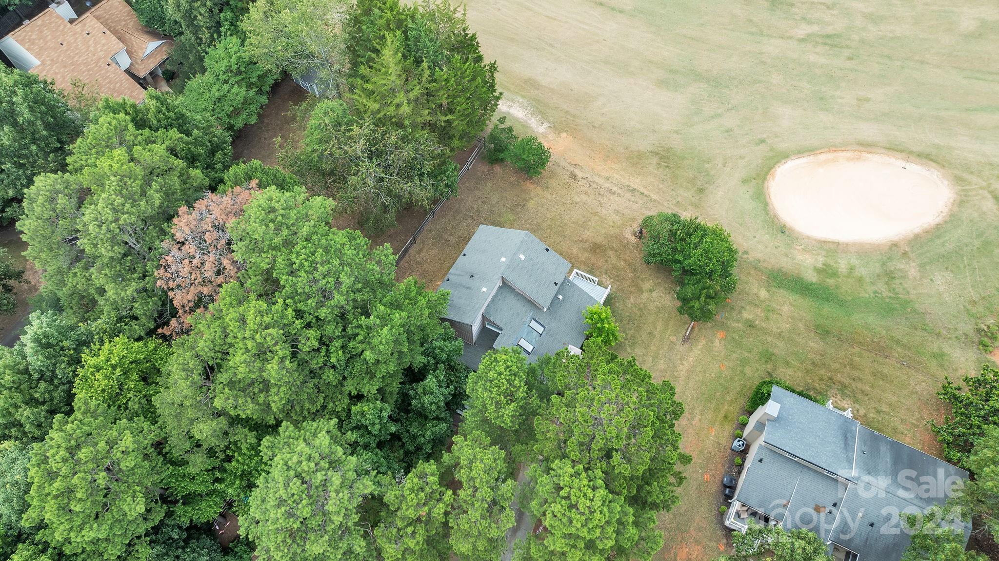 1018 Palmyra Drive Tega Cay, SC 29708 - Photo 4 of 36 an aerial view of a house with a yard and garden