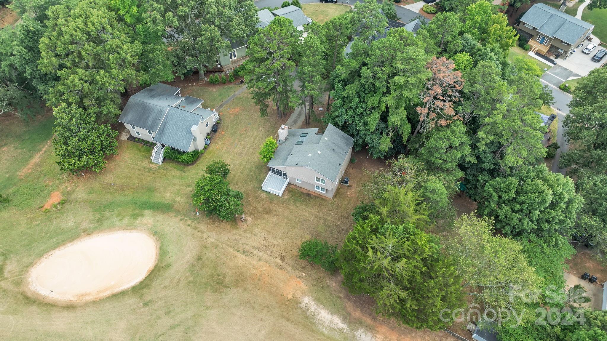 1018 Palmyra Drive Tega Cay, SC 29708 - Photo 5 of 36 an aerial view of a house with outdoor space and trees all around