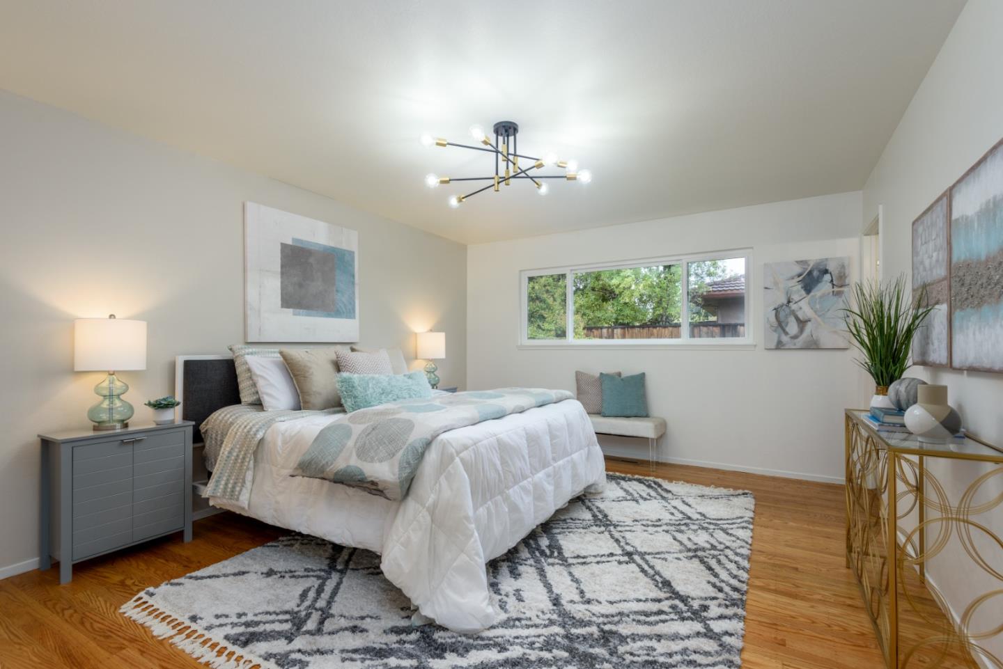 1550 Wright Avenue Sunnyvale, CA 94087 - Photo 16 of 29 a bedroom with a bed and a window