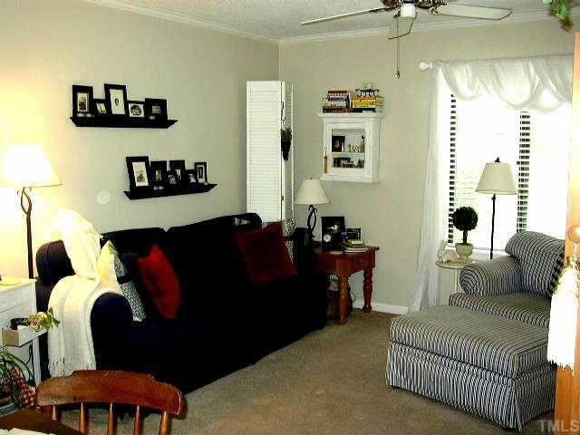 6925 Staghorn Lane Raleigh, NC 27615 - Photo 3 of 12 Large, comfortable living room with fireplace. Other