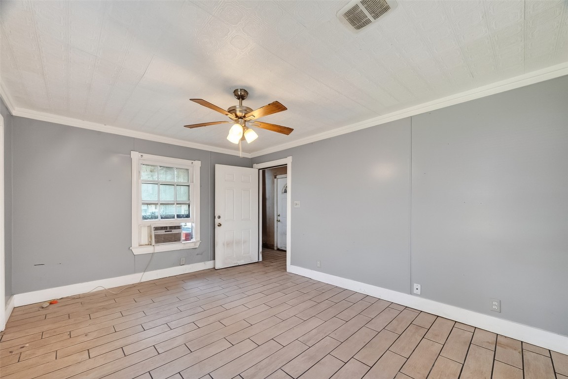 15627 Market Street Channelview, TX 77530 - Photo 13 of 35 wooden floor in an empty room with a window
