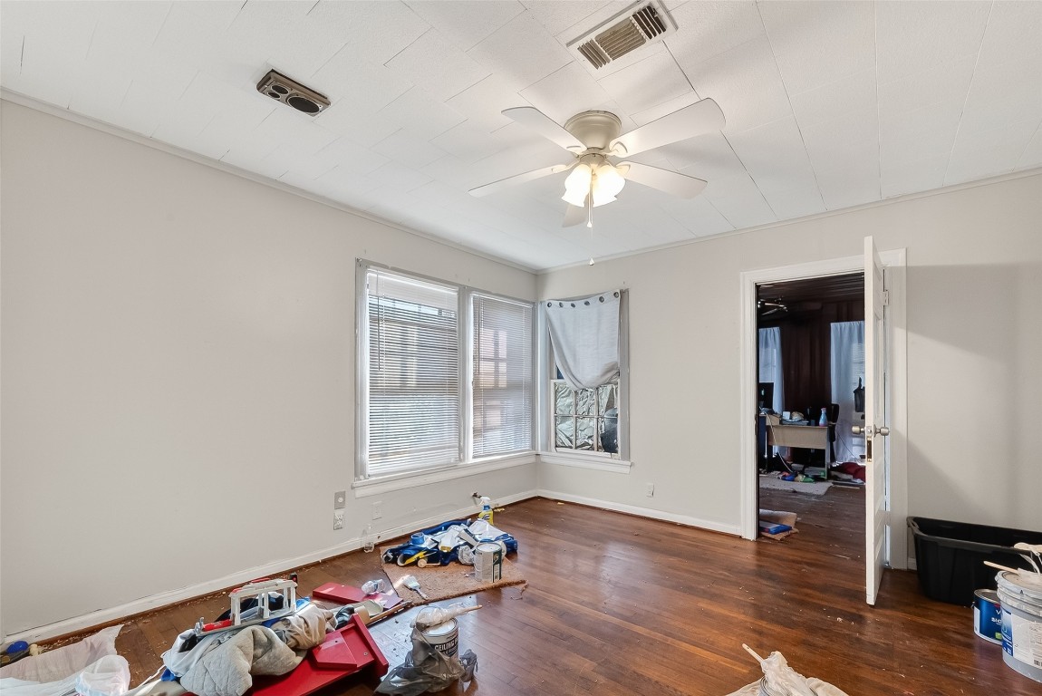 15627 Market Street Channelview, TX 77530 - Photo 14 of 35 a view of an empty room with window and wooden floor