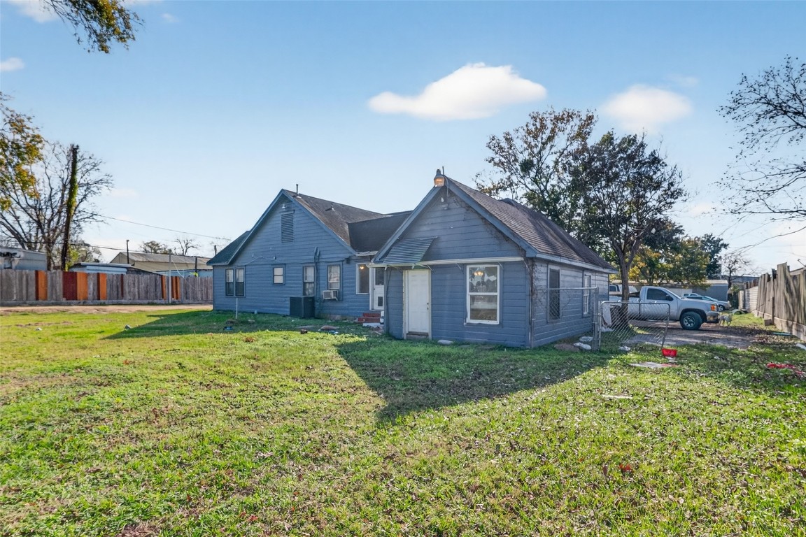 15627 Market Street Channelview, TX 77530 - Photo 18 of 35 a view of a yard in front of a house with a large tree