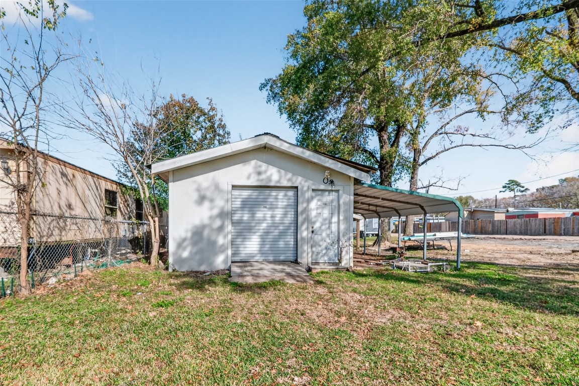 15627 Market Street Channelview, TX 77530 - Photo 20 of 35 a view of a house with a yard