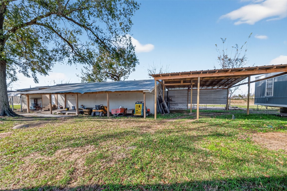 15627 Market Street Channelview, TX 77530 - Photo 23 of 35 a view of a house with a yard and sitting area