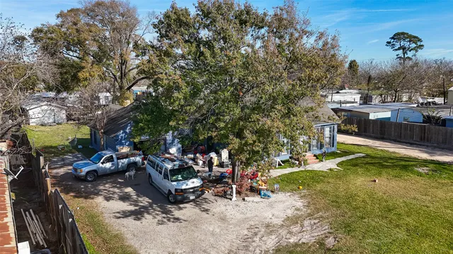 a view of a backyard with plants and a patio