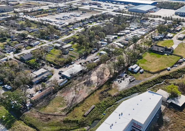 an aerial view of a residential houses with outdoor space