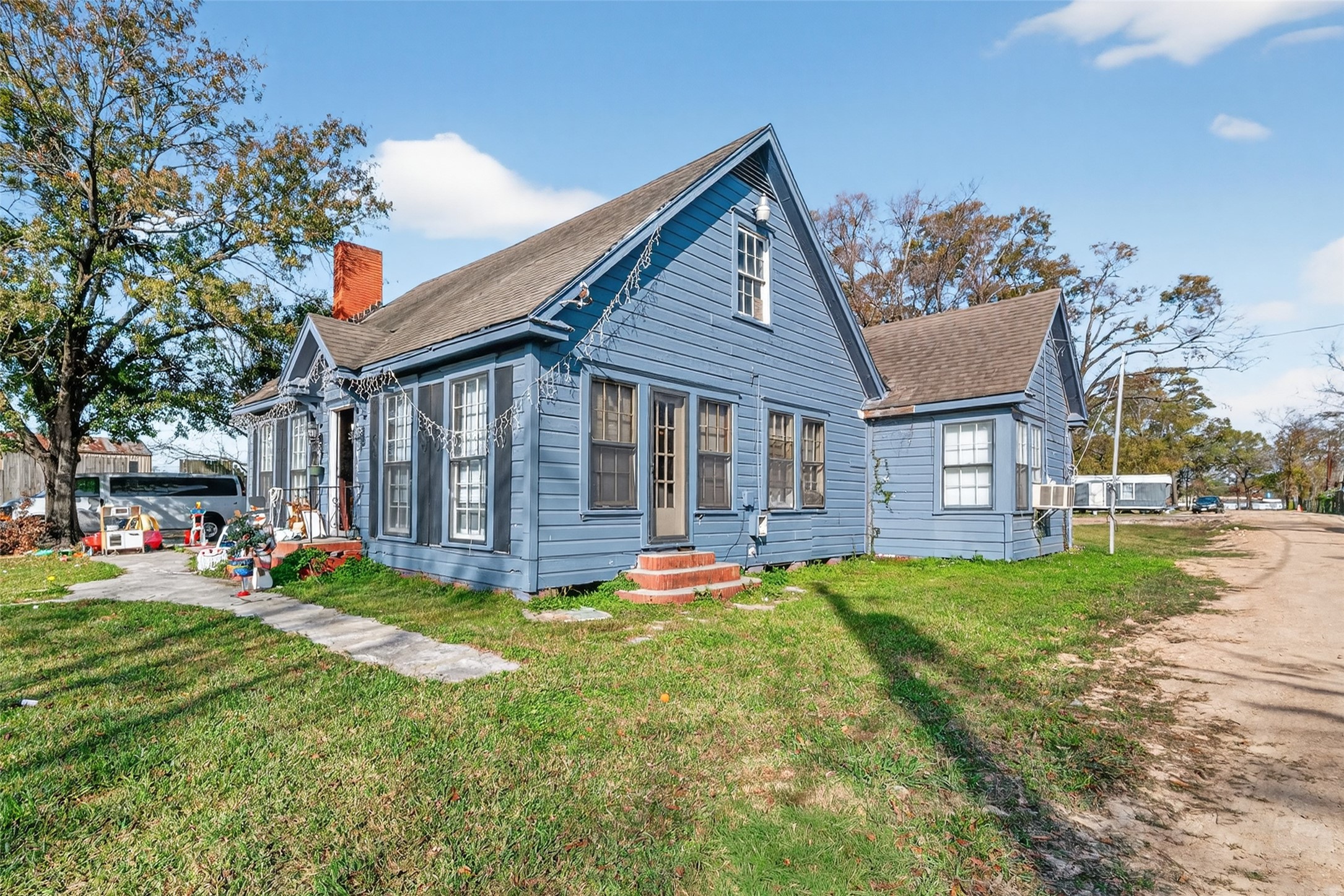 15627 Market Street Channelview, TX 77530 - Photo 6 of 35 a view of a house with a yard porch and sitting area