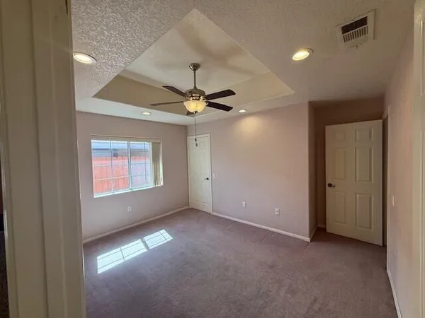 a view of an empty room with a window