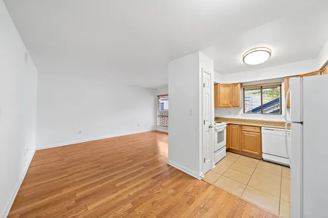 a view of a kitchen with a sink and a stove top oven