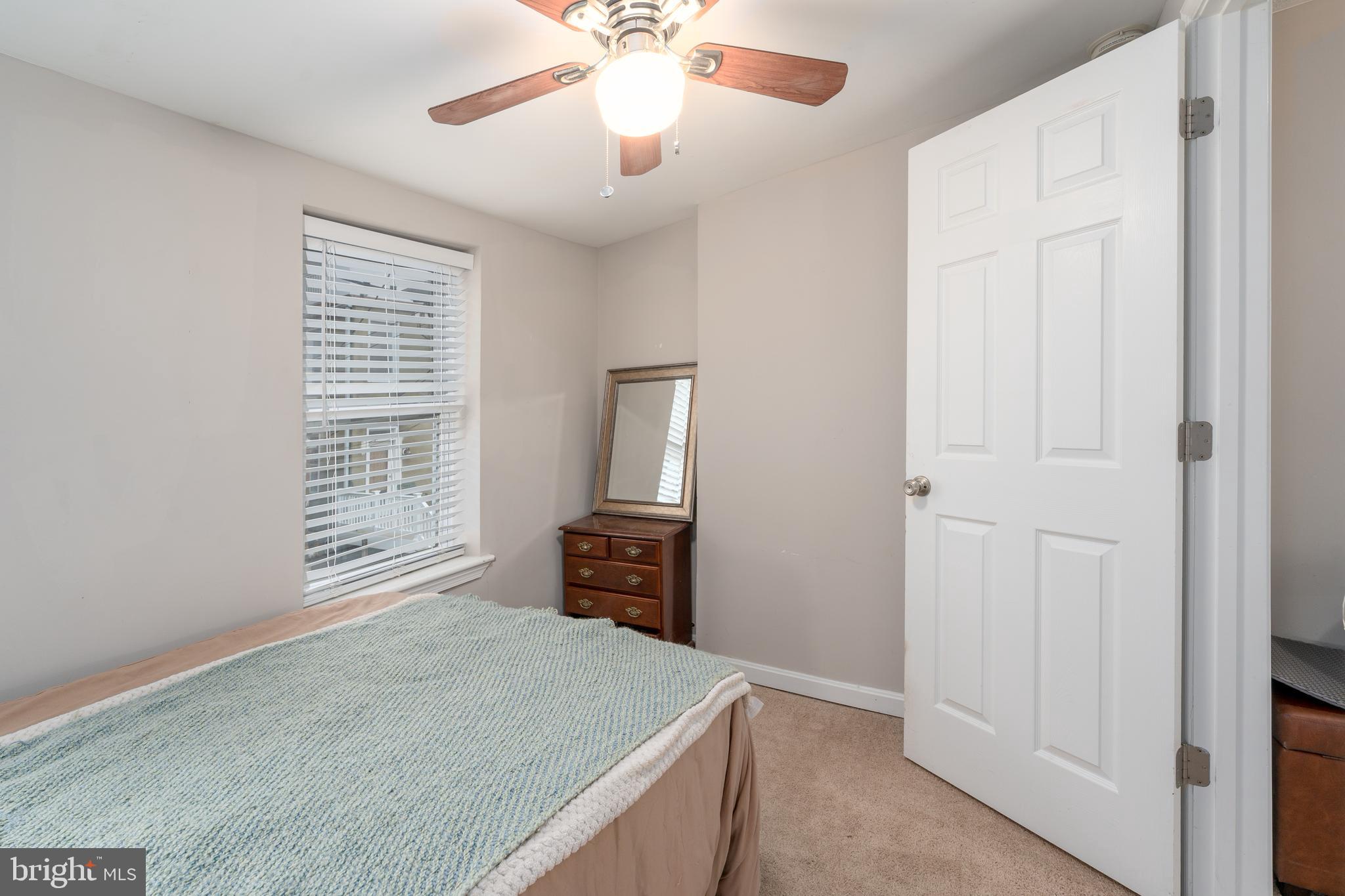 1627 Olive Street Baltimore, MD 21230 - Photo 13 of 22 an empty room with windows and cabinet