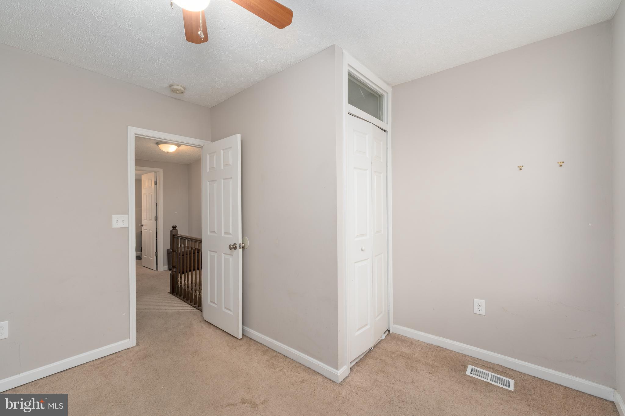 1627 Olive Street Baltimore, MD 21230 - Photo 16 of 22 an empty room with chandelier fan