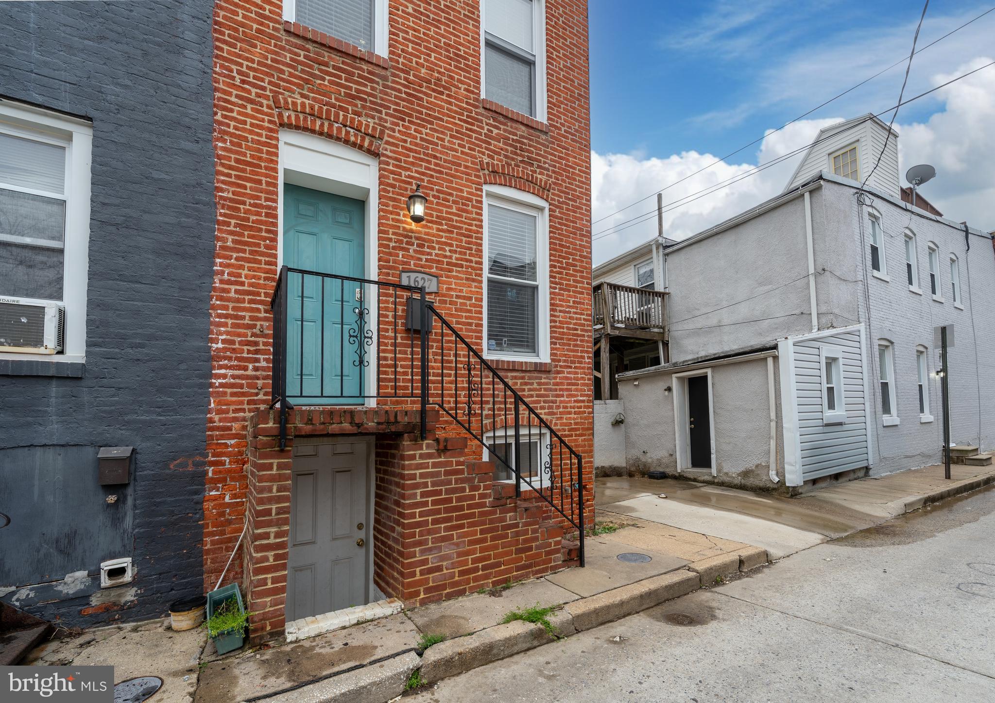 1627 Olive Street Baltimore, MD 21230 - Photo 2 of 22 a view of a house with iron stairs