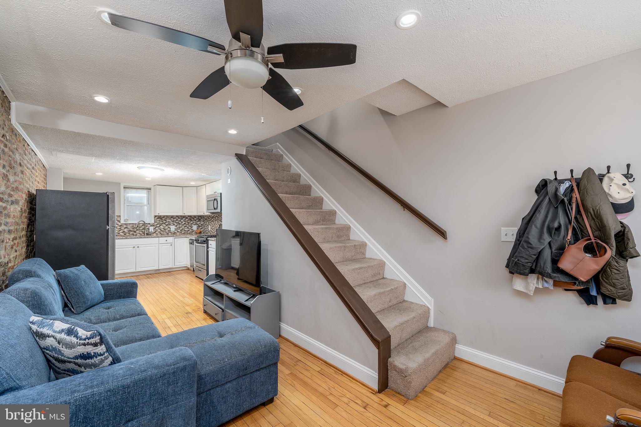 1627 Olive Street Baltimore, MD 21230 - Photo 3 of 22 a living room with furniture and wooden floor