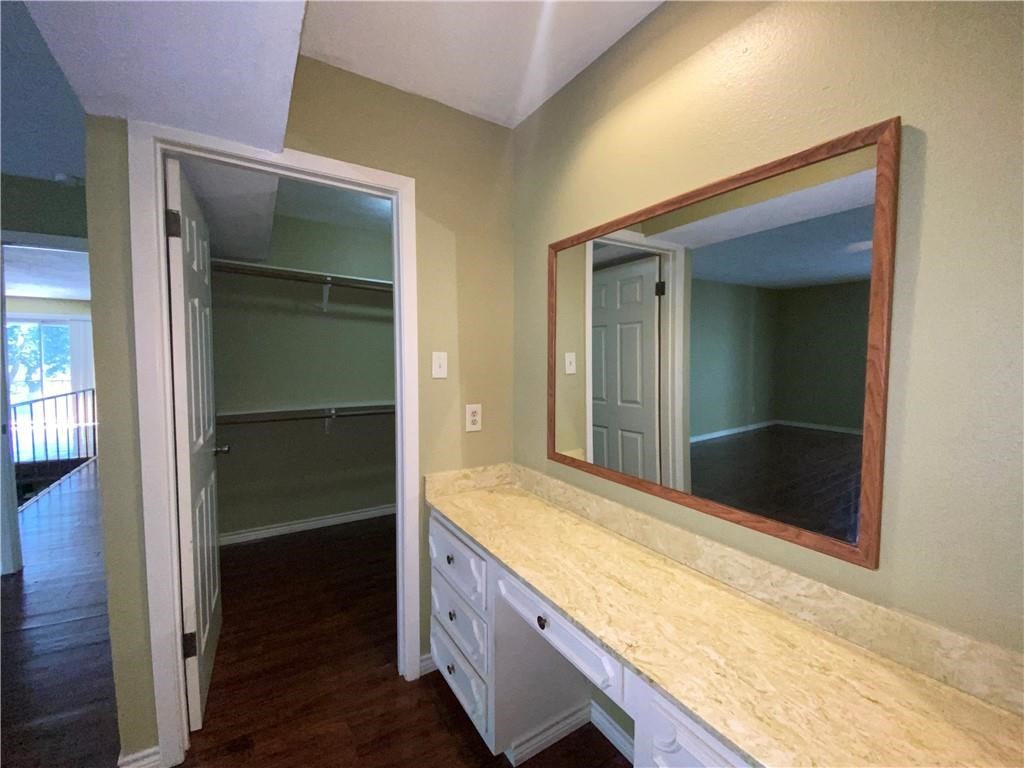310 Sunset Boulevard Portland, TX 78374 - Photo 13 of 18 a bathroom with a granite countertop sink and a mirror
