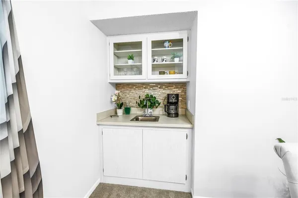 a view of kitchen with cabinets and wooden floor