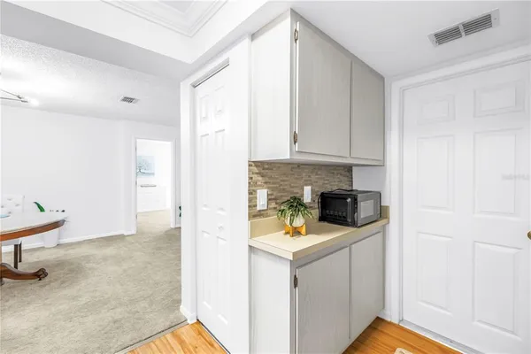 a kitchen with a sink cabinets and window