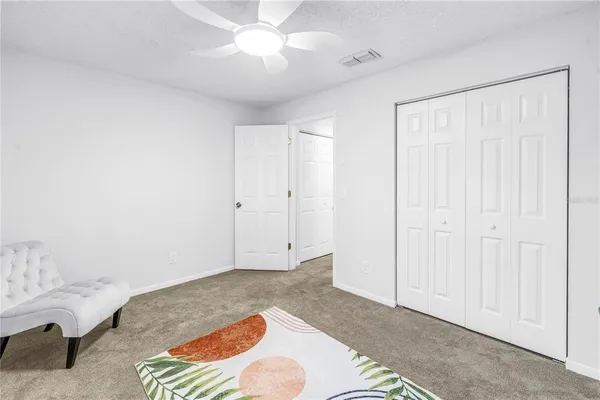 a dining room with furniture a rug and wooden floor
