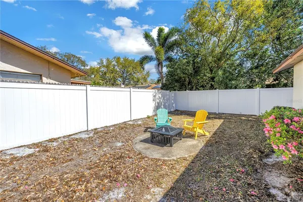 a view of a backyard of the house