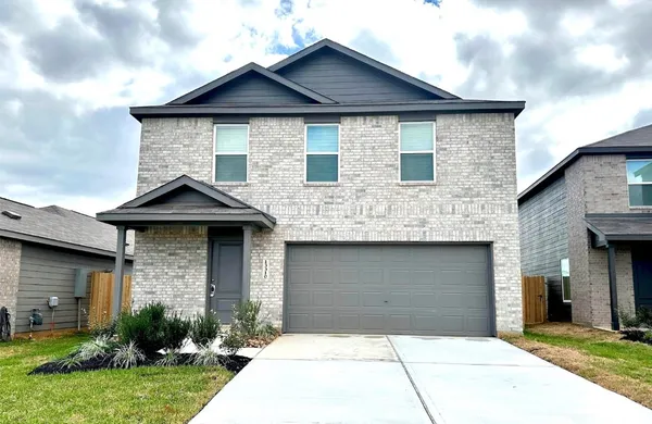a front view of a house with garage