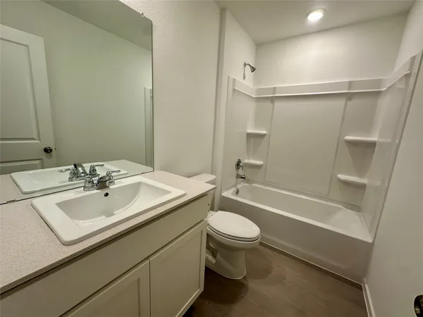 a bathroom with a sink a toilet and a bathtub