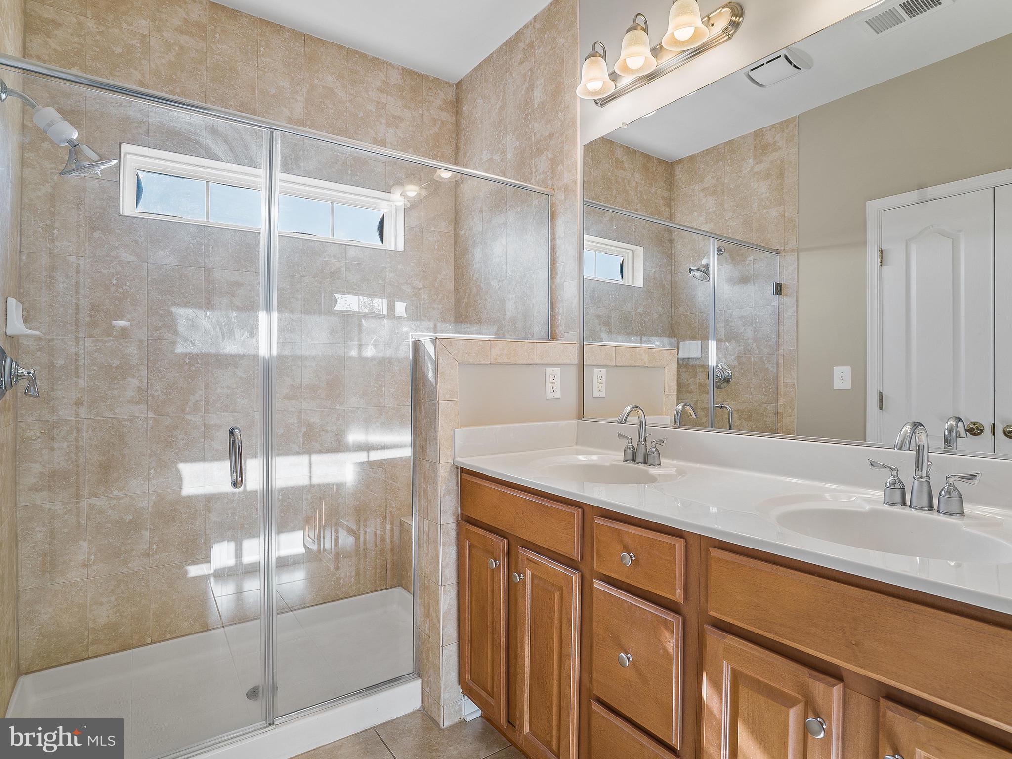 24712 Clock Tower Square Aldie, VA 20105 - Photo 19 of 30 Spacious Walk-in Shower with Seat in Master Bath