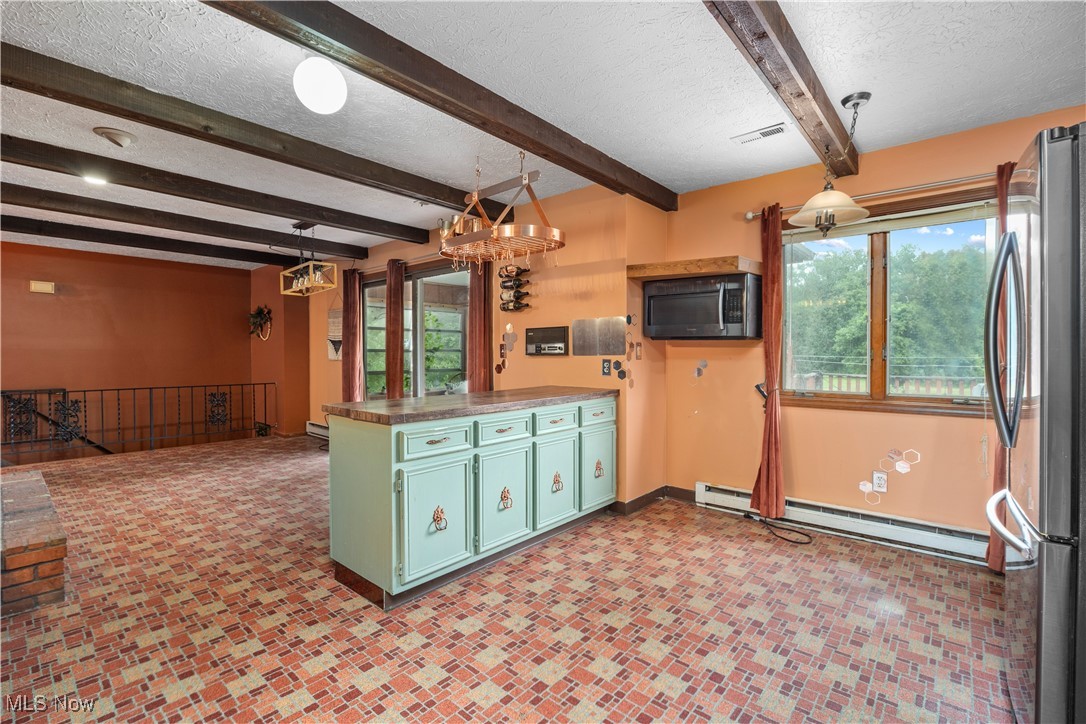 43995 Middle Ridge Road Lorain, OH 44053 - Photo 11 of 49 Kitchen featuring a free-standing peninsula.