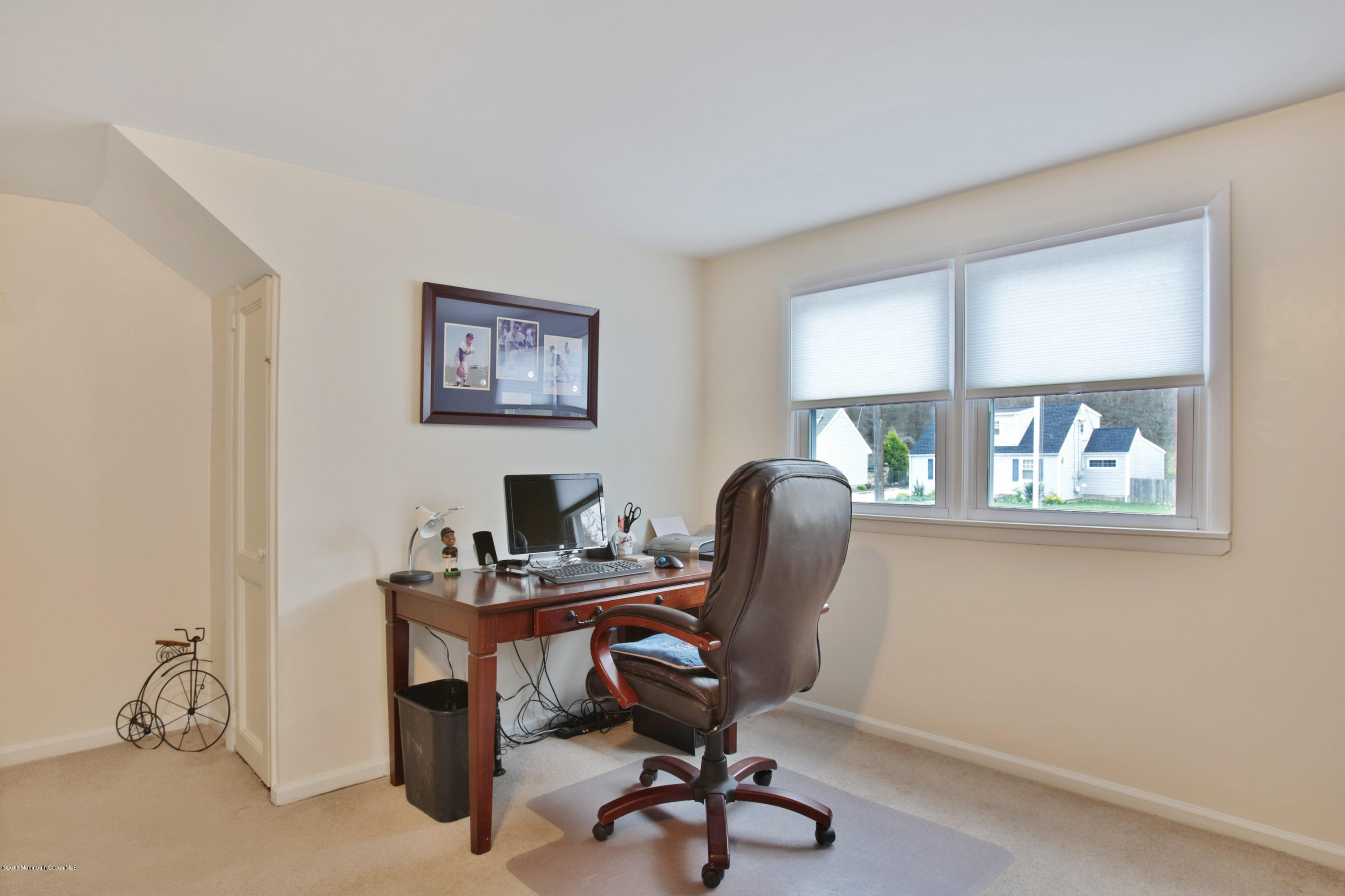 312 Florence Road Middletown, NJ 07748 - Photo 12 of 18 a view of a workspace with furniture and a window