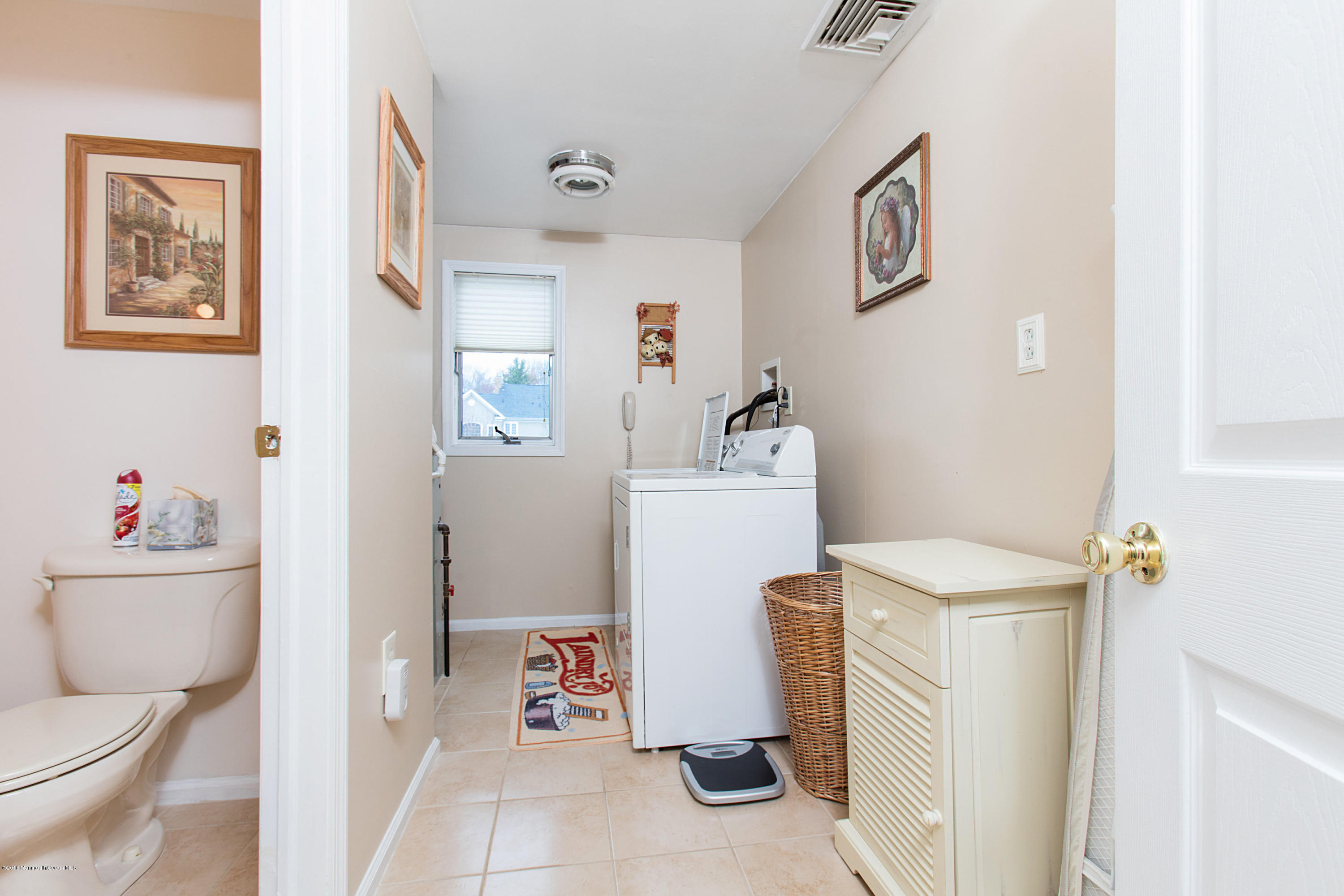 312 Florence Road Middletown, NJ 07748 - Photo 14 of 18 a bathroom with a toilet and a shower curtain