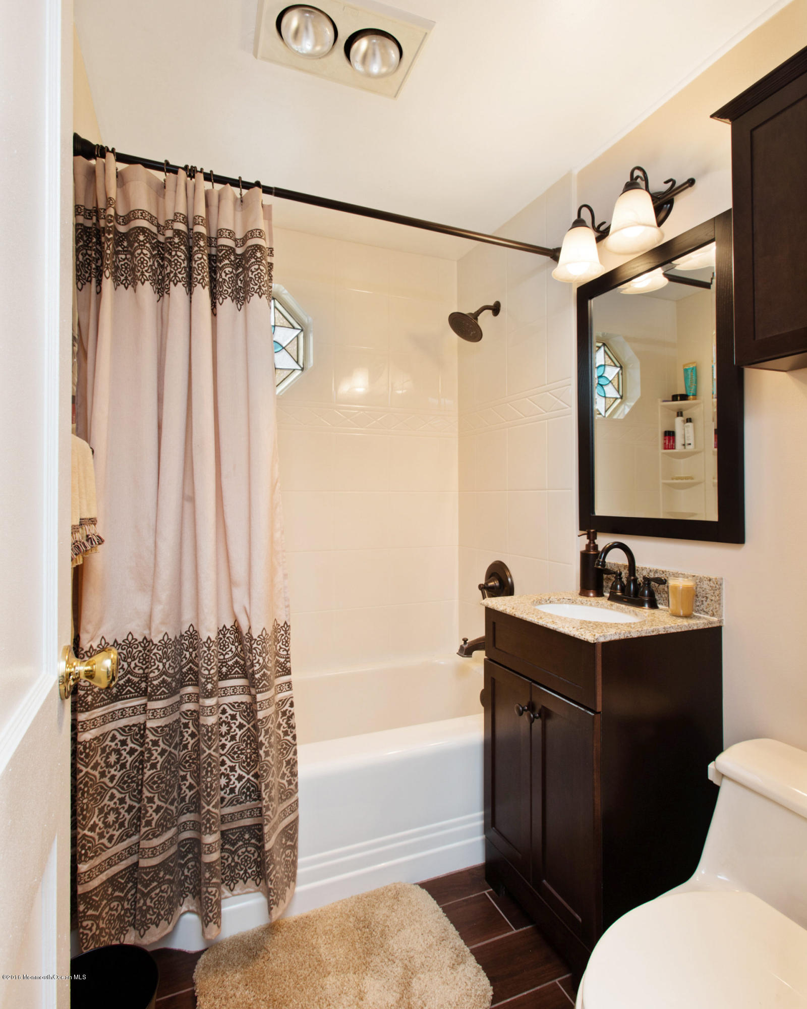 312 Florence Road Middletown, NJ 07748 - Photo 8 of 18 a bathroom with a sink and a mirror