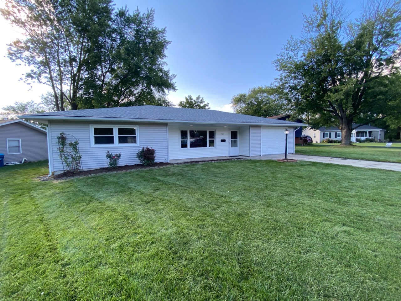 1981 Opal Drive Aurora, IL 60506 - Photo 1 of 18 a front view of house with yard and green space